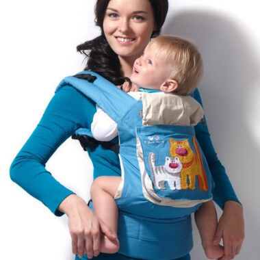 At what age can a child be carried in a backpack?